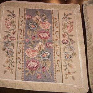 Two embroidered decorative pillow coverings